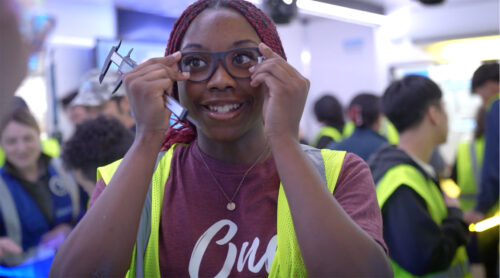 student smiles with sunglasses she made in learning undefeated manufacture your path lab